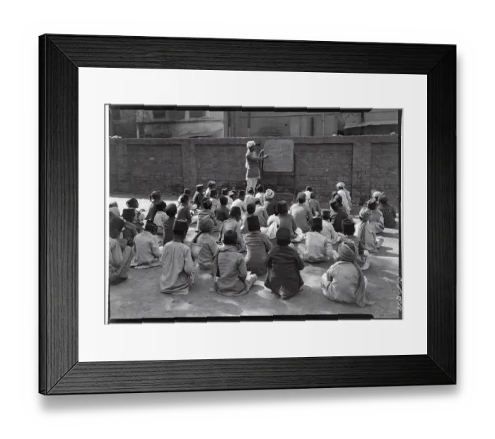 Framed Print : Teacher Instructing Class from Blackboard Framed Print : Teacher Instructing Class from Blackboard