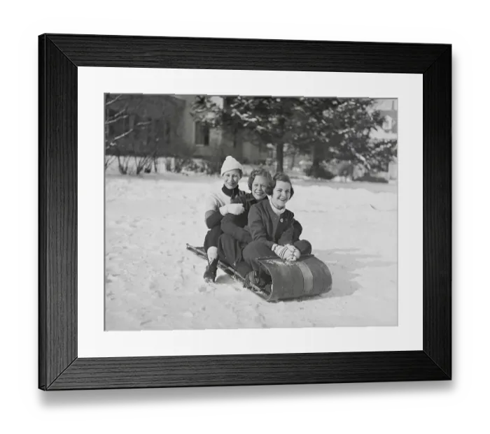 Framed Print : Young Women Riding on Sled Framed Print : Young Women Riding on Sled