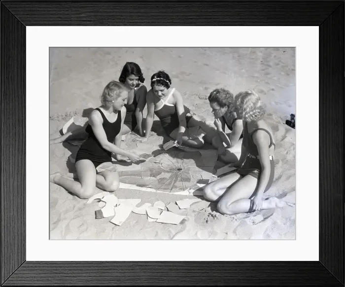 Framed Print : Girls On Beach Working On Puzzle Framed Print : Girls On Beach Working On Puzzle