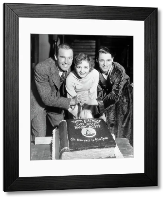 Framed Print : Randolph Scott, Nancy Carroll, and Cary Grant with Birthday Cake Framed Print : Randolph Scott, Nancy Carroll, and Cary Grant with Birthday Cake