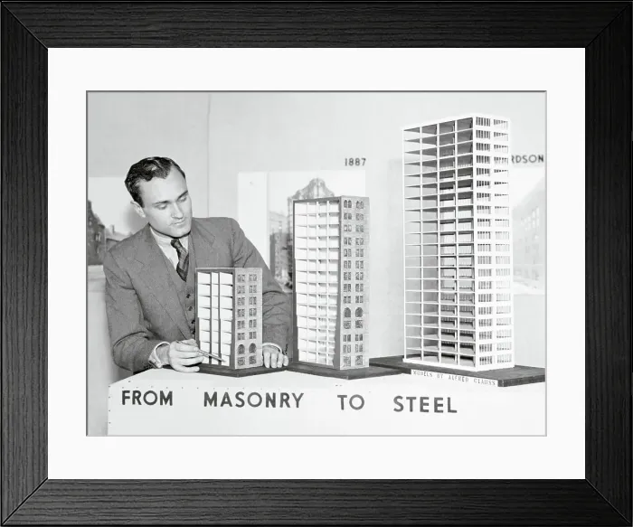 Framed Print : Man Displaying Building Models Framed Print : Man Displaying Building Models