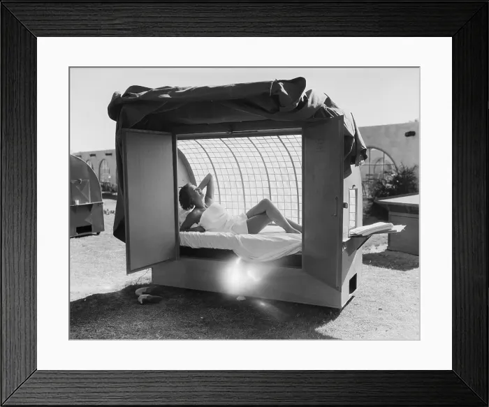 Framed Print : Woman in Outdoor Tanning Booth Framed Print : Woman in Outdoor Tanning Booth
