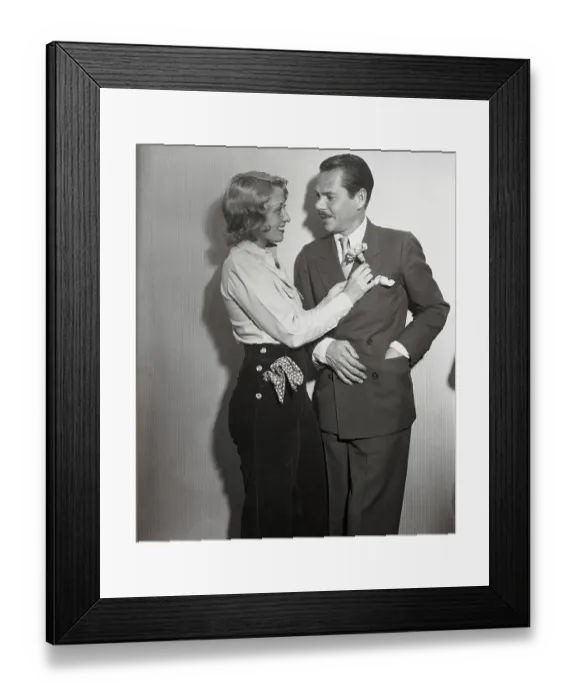 Framed Print : Joan Blondell Placing Flower on Husband's Lapel Framed Print : Joan Blondell Placing Flower on Husband's Lapel