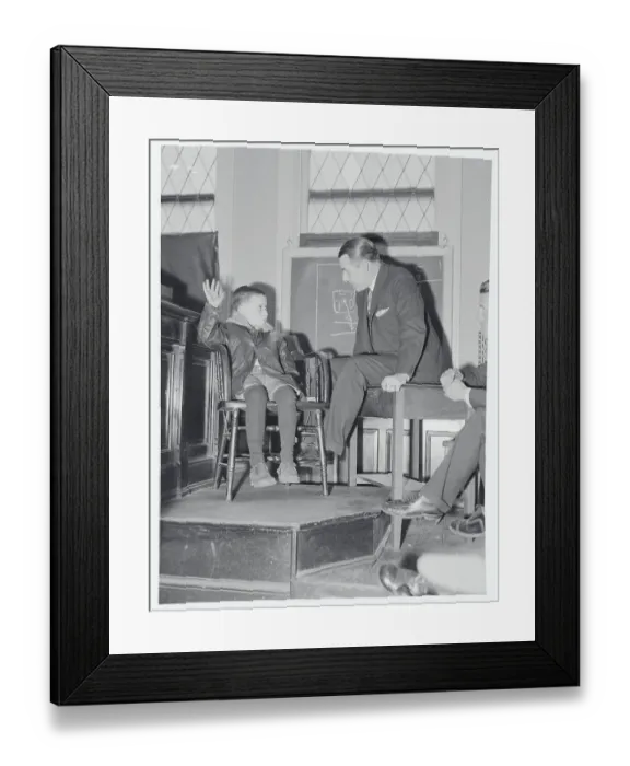 Framed Print : Boy Speaking to Coroner with Arm Raised Framed Print : Boy Speaking to Coroner with Arm Raised