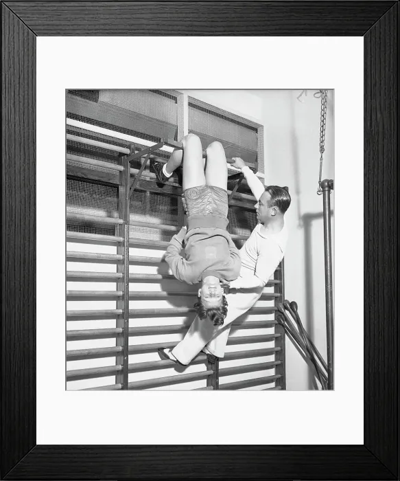 Framed Print : Mildred Didrickson Using Exercise Apparatus with Artie McGovern