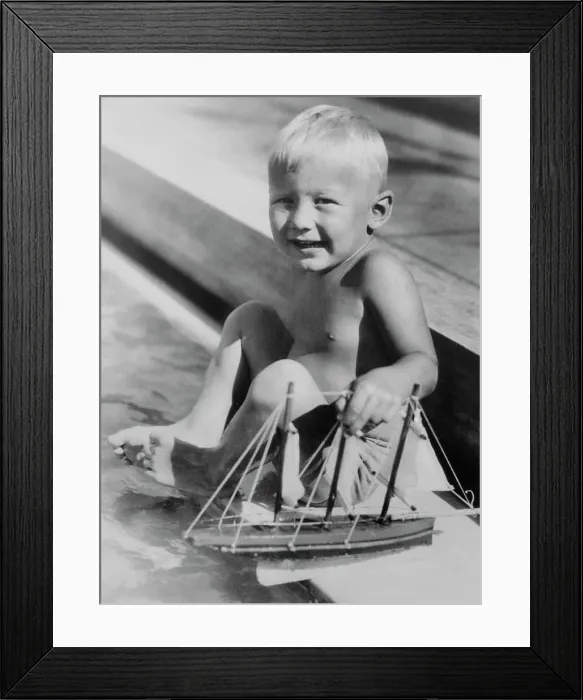 Framed Print : Buzz Aldrin Playing with Toy Boat Framed Print : Buzz Aldrin Playing with Toy Boat