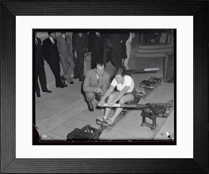Framed Print : Mildred Didrickson Practicing on Machine with Jack Kelly Alongside Framed Print : Mildred Didrickson Practicing on Machine with Jack Kelly Alongside