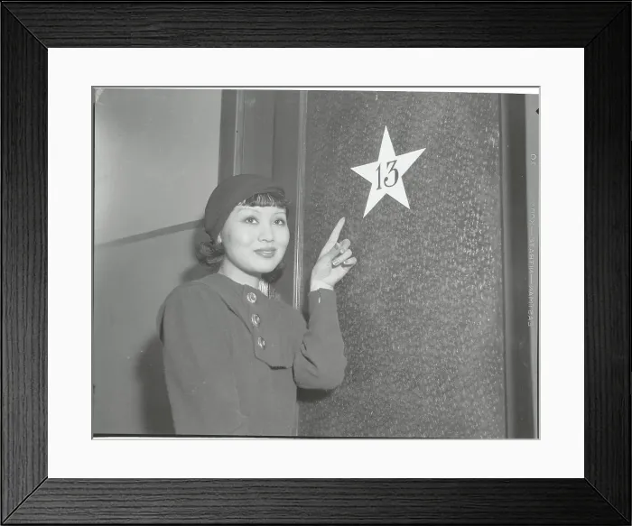 Framed Print : Toshia Mori Pointing to Dressing Room Number Framed Print : Toshia Mori Pointing to Dressing Room Number