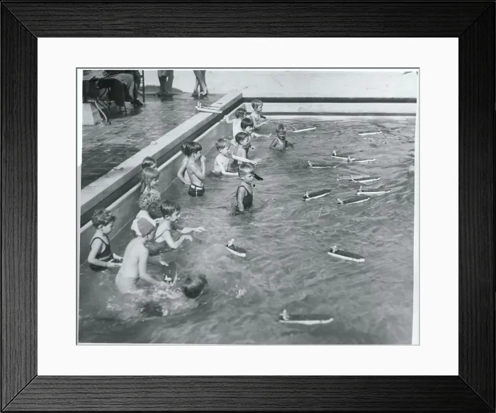 Framed Print : Children Racing Boats in Pool