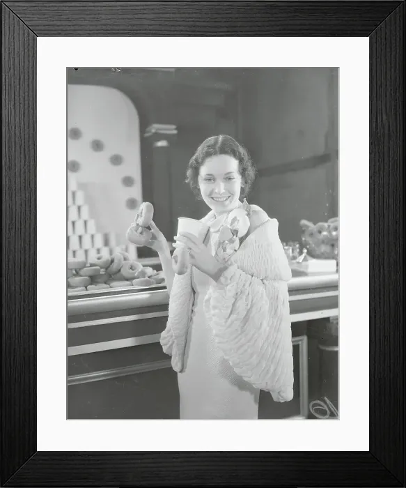 Framed Print : Actress Maureen O'Sullivan with Donut Display Framed Print : Actress Maureen O'Sullivan with Donut Display