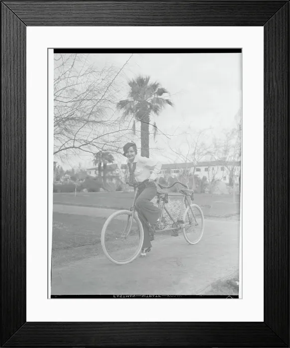 Framed Print : Nancy Carroll Riding Bicycle