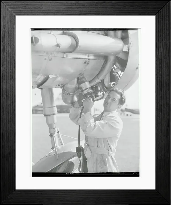 Framed Print : Man with Portable Airplane Starter Framed Print : Man with Portable Airplane Starter