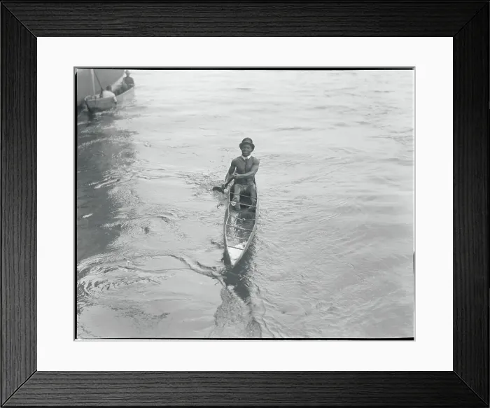 Framed Print : African Coin Diver and Entertainer Boating to Shore Framed Print : African Coin Diver and Entertainer Boating to Shore