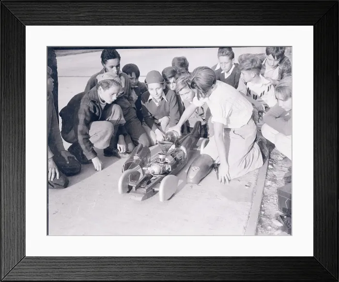 Framed Print : Boys Examining Model Speed Car