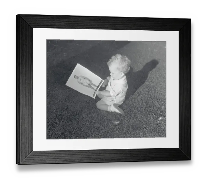 Framed Print : Charlie Paddock's Son Admiring Picture Framed Print : Charlie Paddock's Son Admiring Picture