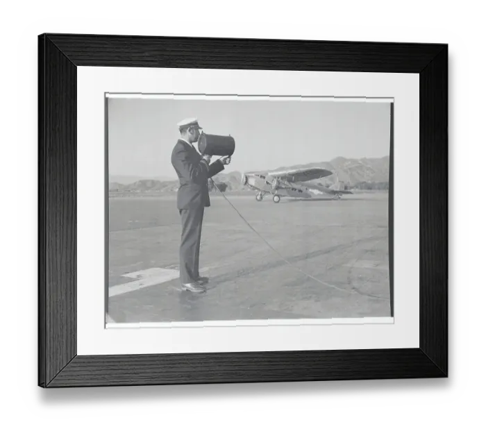 Framed Print : Dispatcher Shooting Electric Beam for Airplanes Framed Print : Dispatcher Shooting Electric Beam for Airplanes