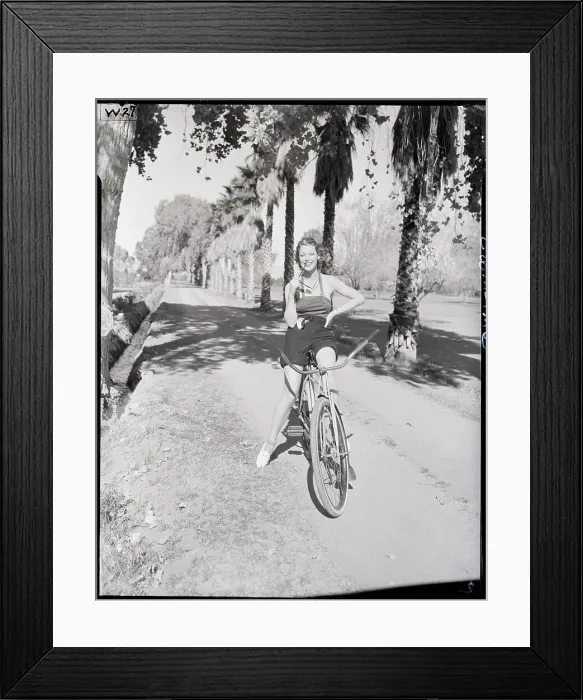 Framed Print : Loretta Young Bicycling in Palm Springs