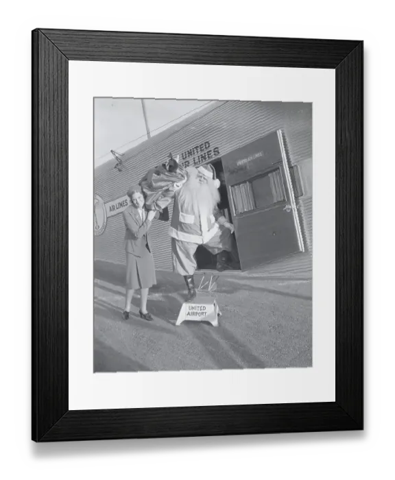Framed Print : Man in Santa Claus Costume Unloading Toys Framed Print : Man in Santa Claus Costume Unloading Toys