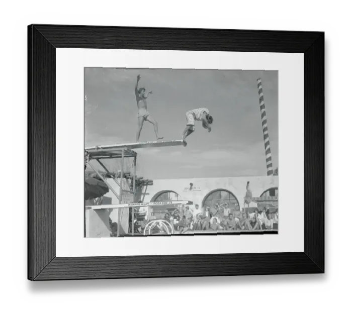 Framed Print : Johnny Weismuller Reinforcing Stubby Kreuger's Dive into Pool
