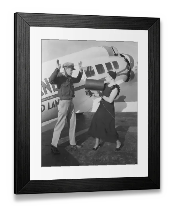 Framed Print : Mrs. Harry Downes Pointing Light Beam at Husband Framed Print : Mrs. Harry Downes Pointing Light Beam at Husband
