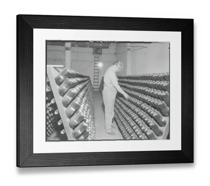 Framed Print : Man Turning Bottles of Champagne Framed Print : Man Turning Bottles of Champagne