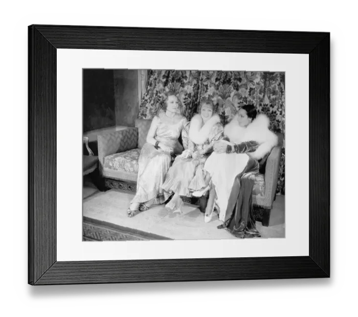 Framed Print : Film Stars Posing on Couch Framed Print : Film Stars Posing on Couch