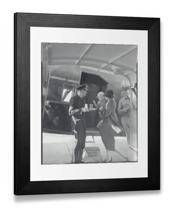 Framed Print : Air Steward Offering Milk to Baby Framed Print : Air Steward Offering Milk to Baby