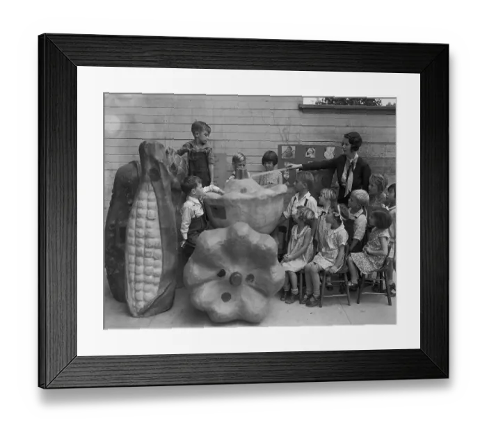 Framed Print : Teacher Using Large Food Models in Classroom Framed Print : Teacher Using Large Food Models in Classroom