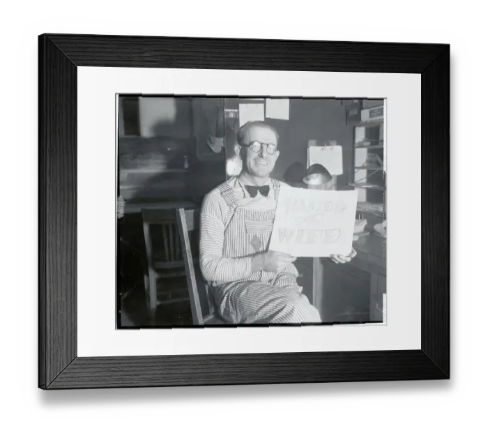 Framed Print : Man Wearing Overalls Holding Sign Asking for a Wife Framed Print : Man Wearing Overalls Holding Sign Asking for a Wife
