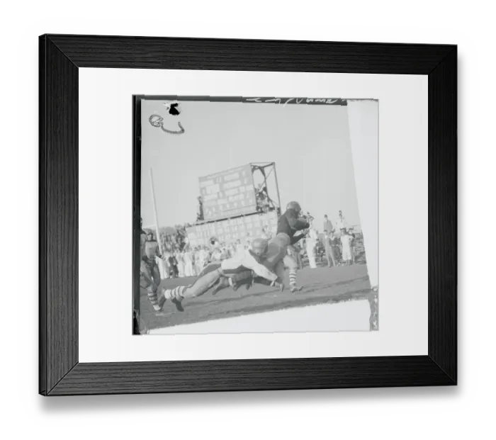 Framed Print : Football Player Breaking Free from Tackle Framed Print : Football Player Breaking Free from Tackle