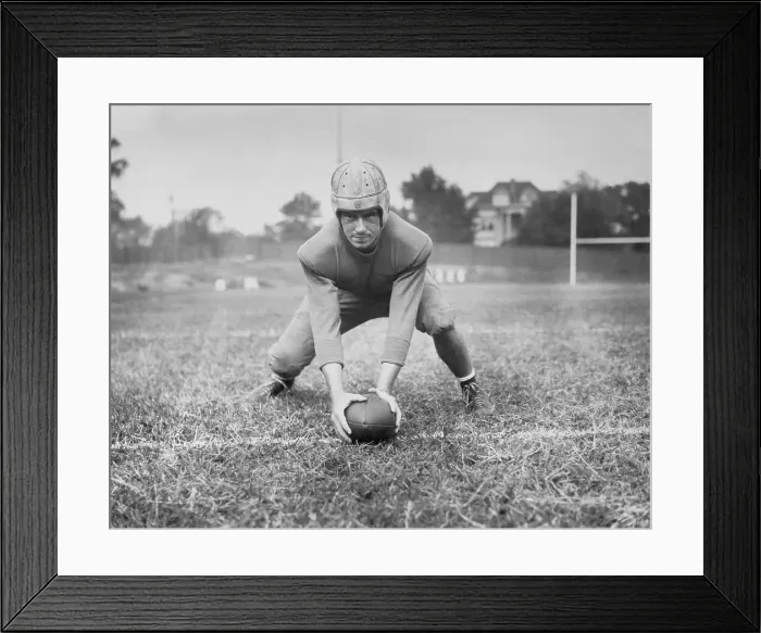 Framed Print : Football Player Val Kneeling with Football Framed Print : Football Player Val Kneeling with Football