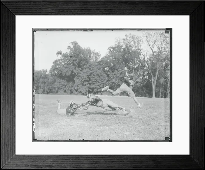 Framed Print : Football Player Escaping Tackle Framed Print : Football Player Escaping Tackle