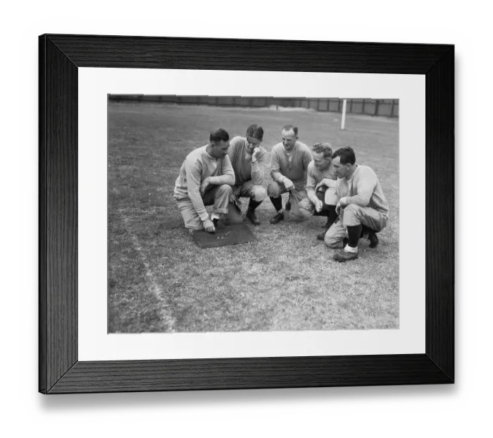 Framed Print : College Football Coaches Conversing in Huddle Framed Print : College Football Coaches Conversing in Huddle