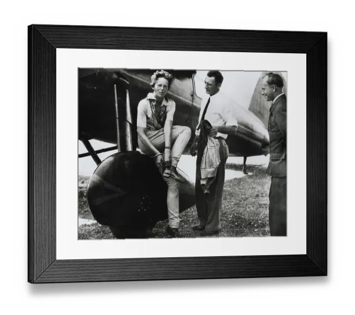 Framed Print : Aviatrix Amelia Earhart Adjusting Her Shoes After Successful Flight Framed Print : Aviatrix Amelia Earhart Adjusting Her Shoes After Successful Flight