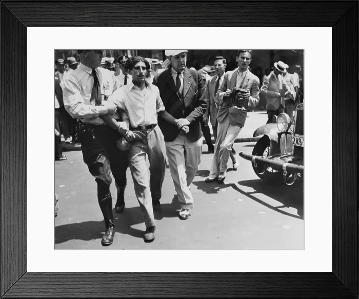 Framed Print : Policeman Escorting Man Framed Print : Policeman Escorting Man