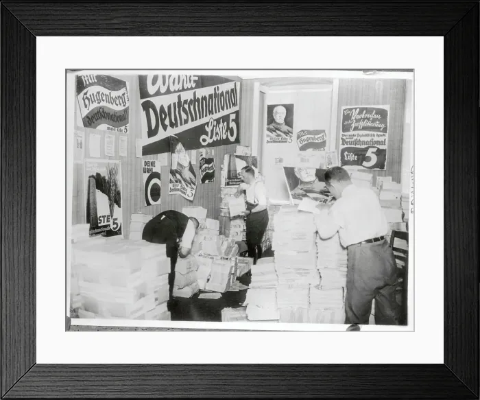 Framed Print : Two Men Going Through German Propaganda Materials Framed Print : Two Men Going Through German Propaganda Materials