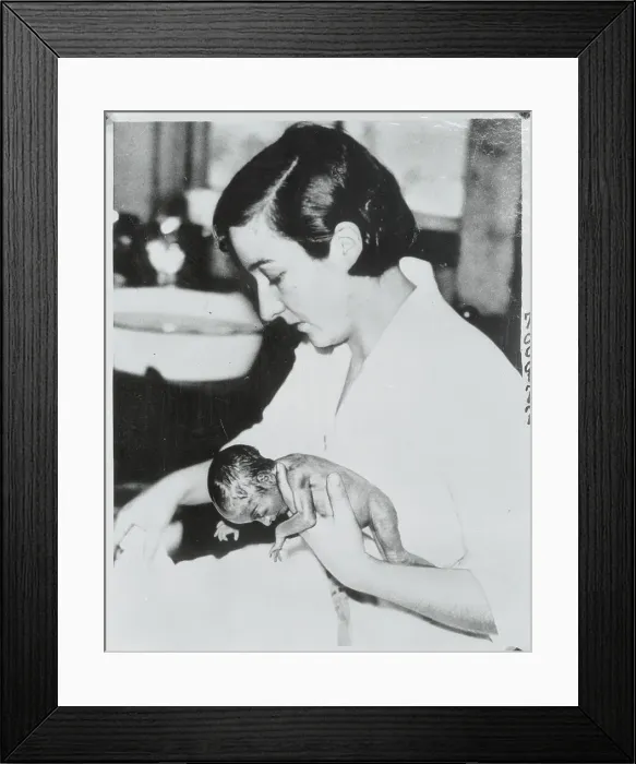 Framed Print : Nurse Holding Infant Quintuplet Framed Print : Nurse Holding Infant Quintuplet