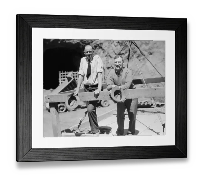 Framed Print : Two Men Standing at Dam Site