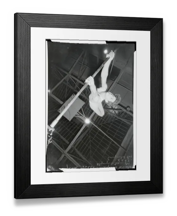 Framed Print : Athlete Practicing Routine on Horizontal Bar Framed Print : Athlete Practicing Routine on Horizontal Bar