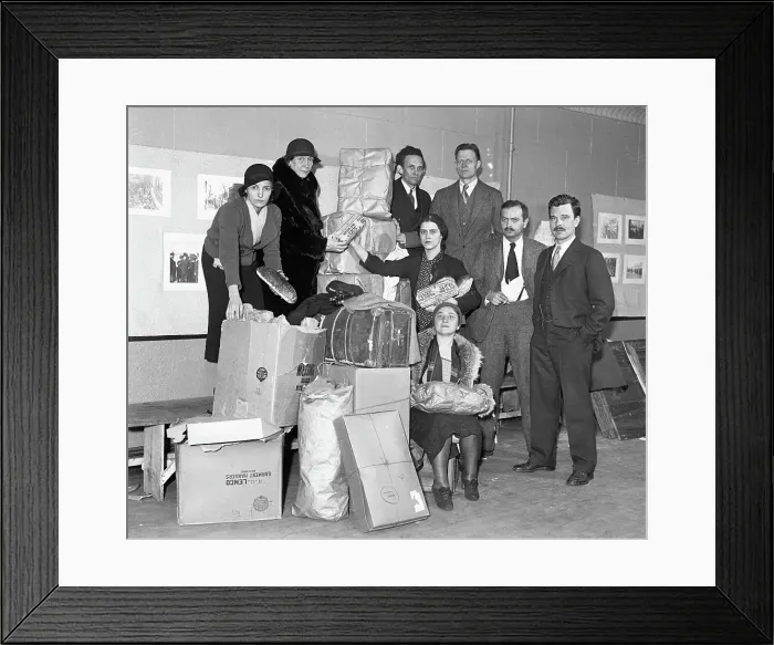 Framed Print : Group Posing with Boxes and Holding Bread