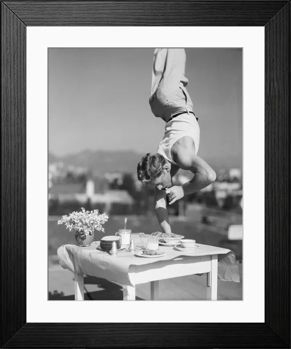 Framed Print : Gymnast Richard Landau Performs Handstand on Table Framed Print : Gymnast Richard Landau Performs Handstand on Table