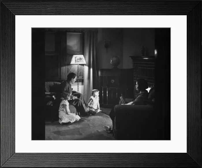 Framed Print : Family Listening to Radio at Home Framed Print : Family Listening to Radio at Home