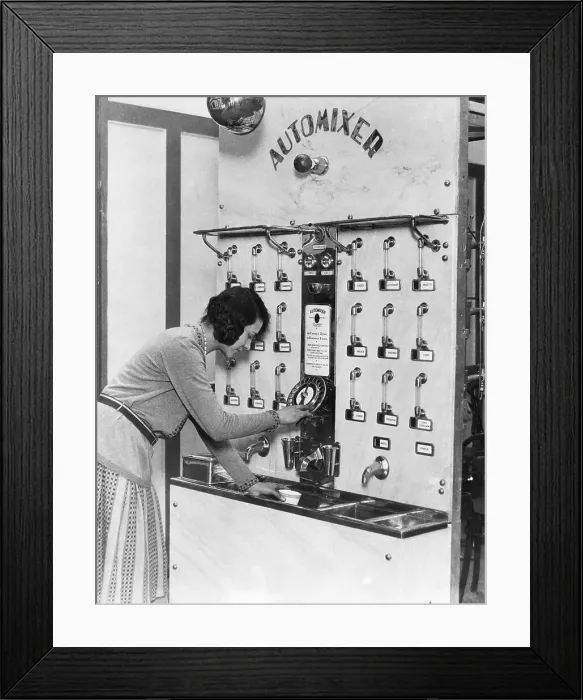 Framed Print : Woman Using Automated Cocktail Mixer