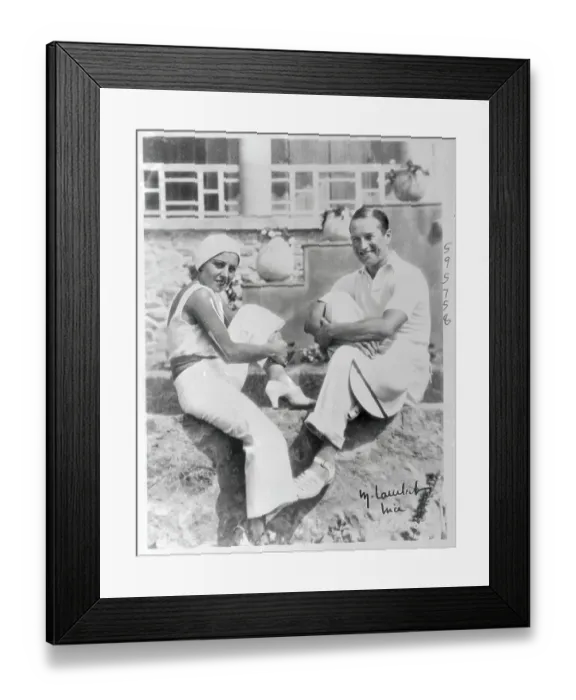 Framed Print : Mr. and Mrs. Maurice Chevalier Sitting by Sidewalk Framed Print : Mr. and Mrs. Maurice Chevalier Sitting by Sidewalk
