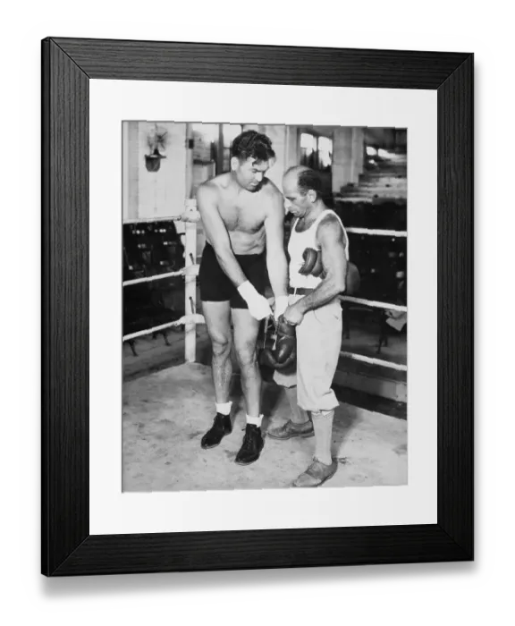 Framed Print : Jack Dempsey Putting on Boxing Gloves Framed Print : Jack Dempsey Putting on Boxing Gloves