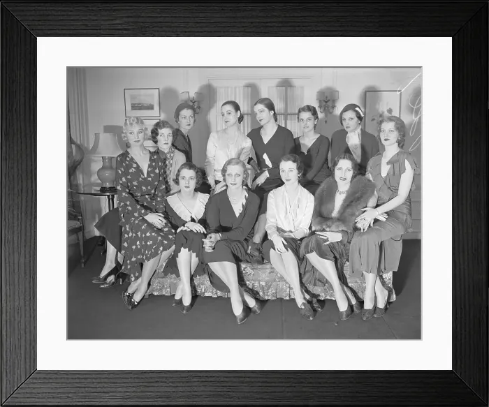 Framed Print : Models Sitting on Couch Framed Print : Models Sitting on Couch
