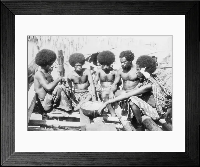 Framed Print : Papuan Men Eating Meal