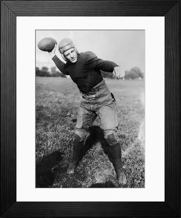 Framed Print : Harold Red Grange Throwing a Football Framed Print : Harold Red Grange Throwing a Football