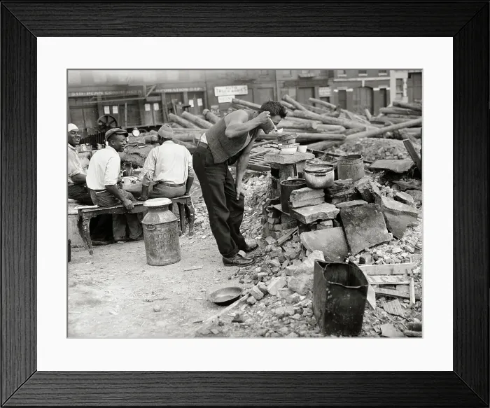 Framed Print : Hobo in Makeshift Camp and Tasting from a Pot of Food Framed Print : Hobo in Makeshift Camp and Tasting from a Pot of Food