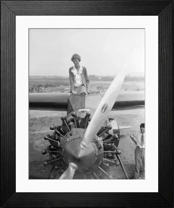 Framed Print : Amelia Earhart Sitting Atop Airplane Framed Print : Amelia Earhart Sitting Atop Airplane